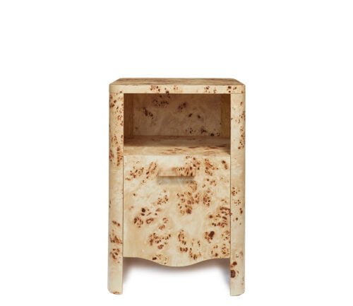 A small wood-patterned bedside table with a large drawer.