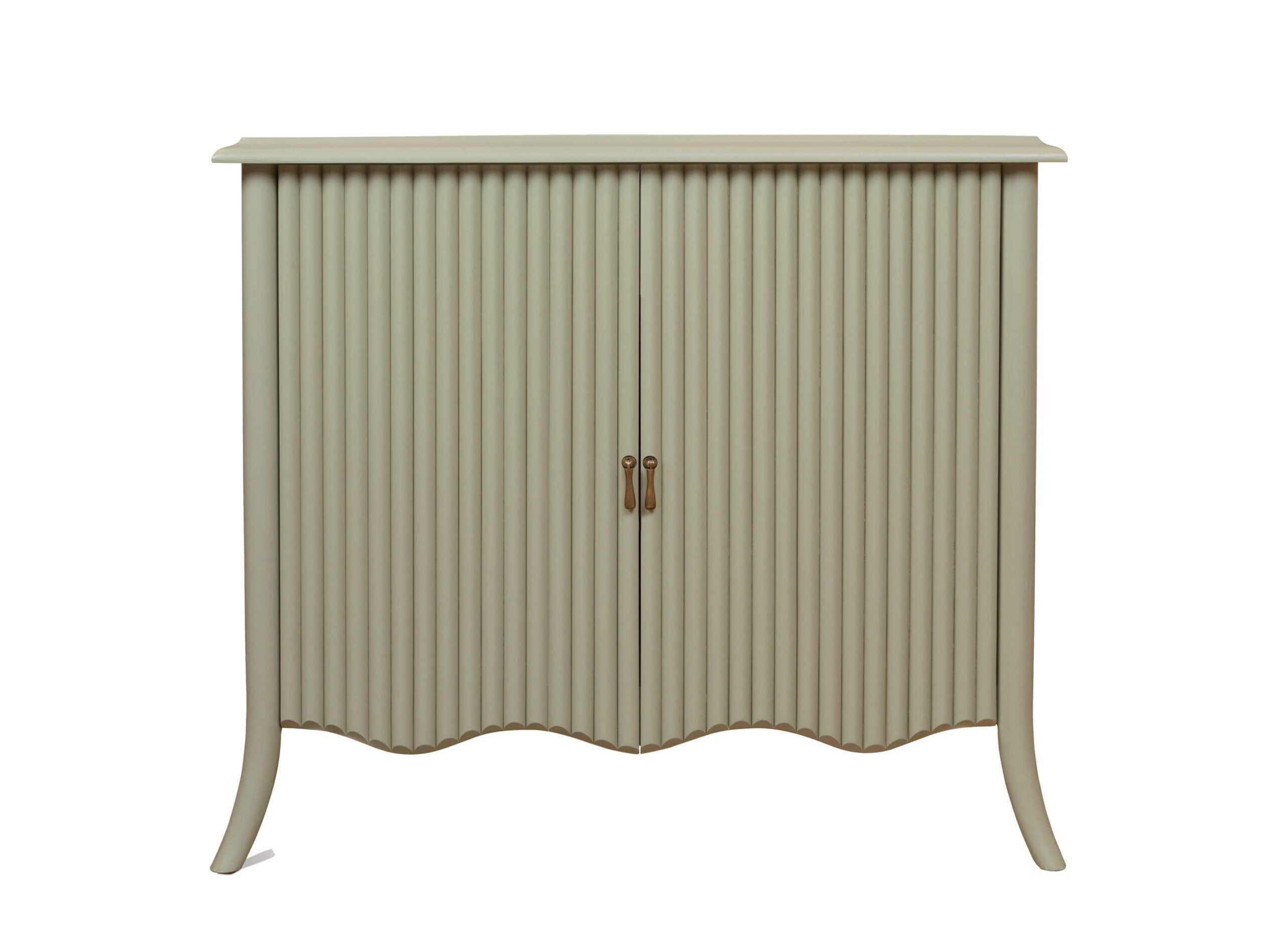 A pistachio-coloured sideboard with bamboo-style doors and a wavy bottom.