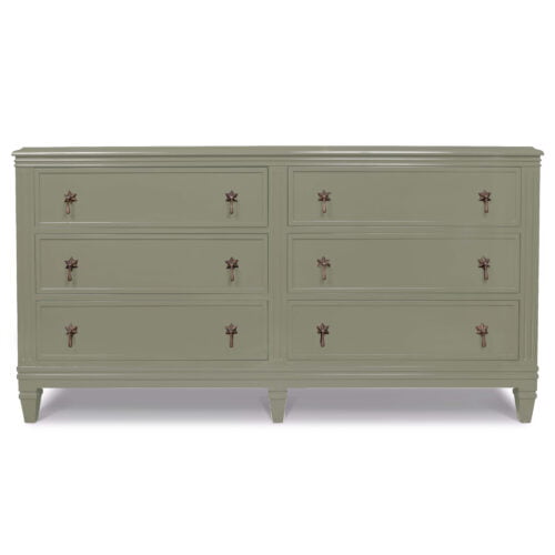 A pistachio-coloured large double chest of drawers with six drawers, each with two star-shaped pull handles.