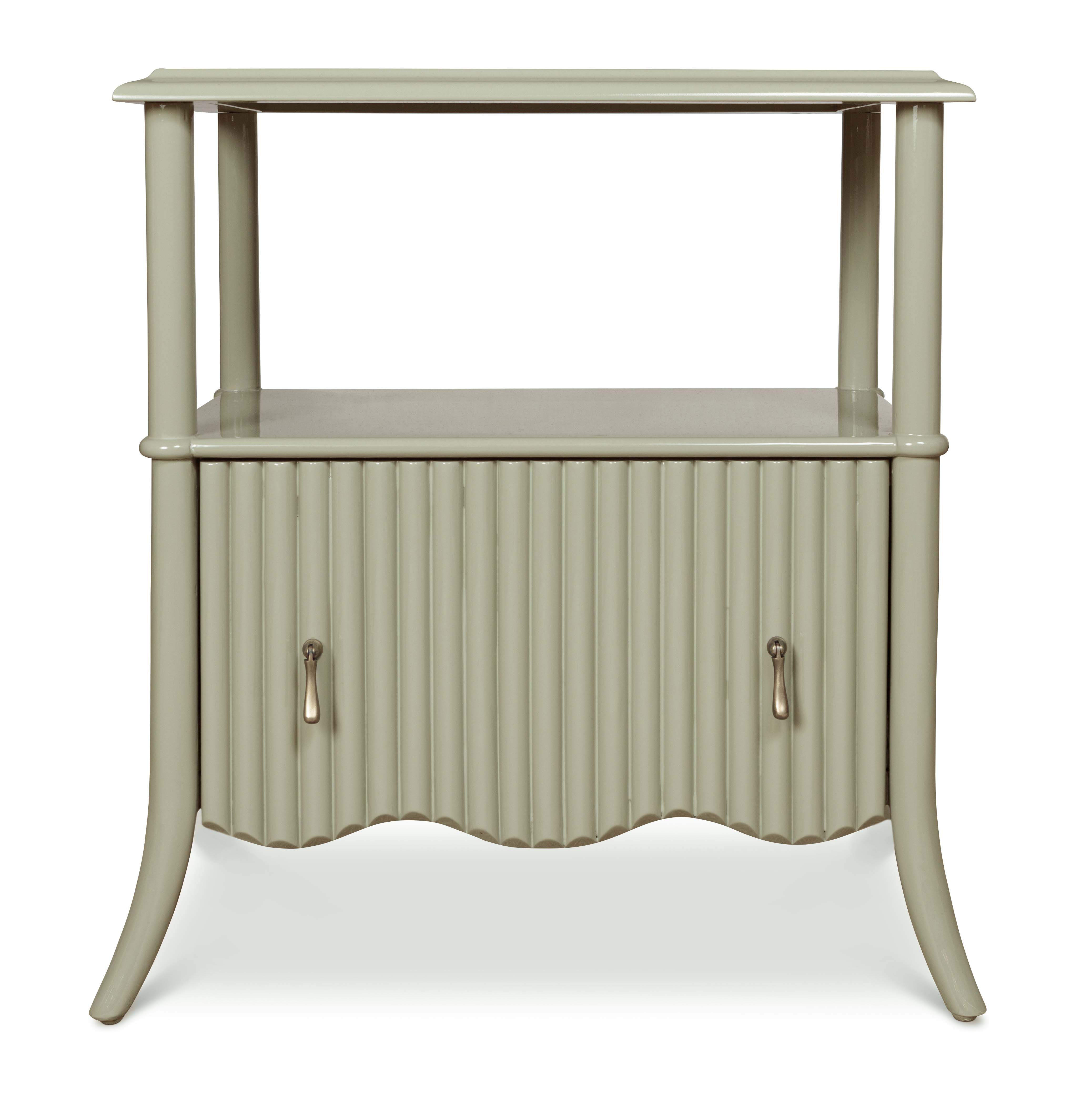A pistachio-coloured, bamboo-style wooden bedside table with pull handles.
