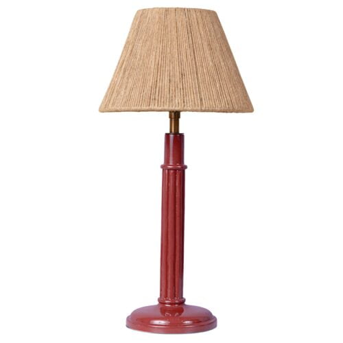 A red table lamp with a rattan lampshade and the light off.