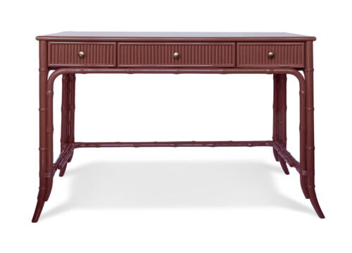 A bamboo-style, burgundy dressing table with one big drawer in the middle and two smaller drawers on either side.