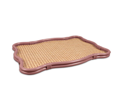 An off-red, wavy-framed decorative rattan tray.